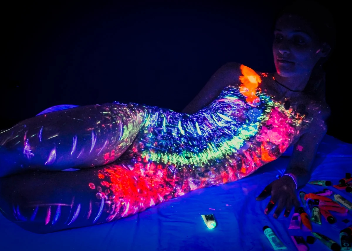 UV blacklight neon body painting — The Wild Nest, Ferrara