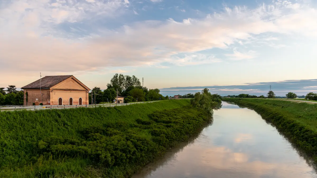 Bondenese canal with farmhouse at sunset, Po plain, Ferrara