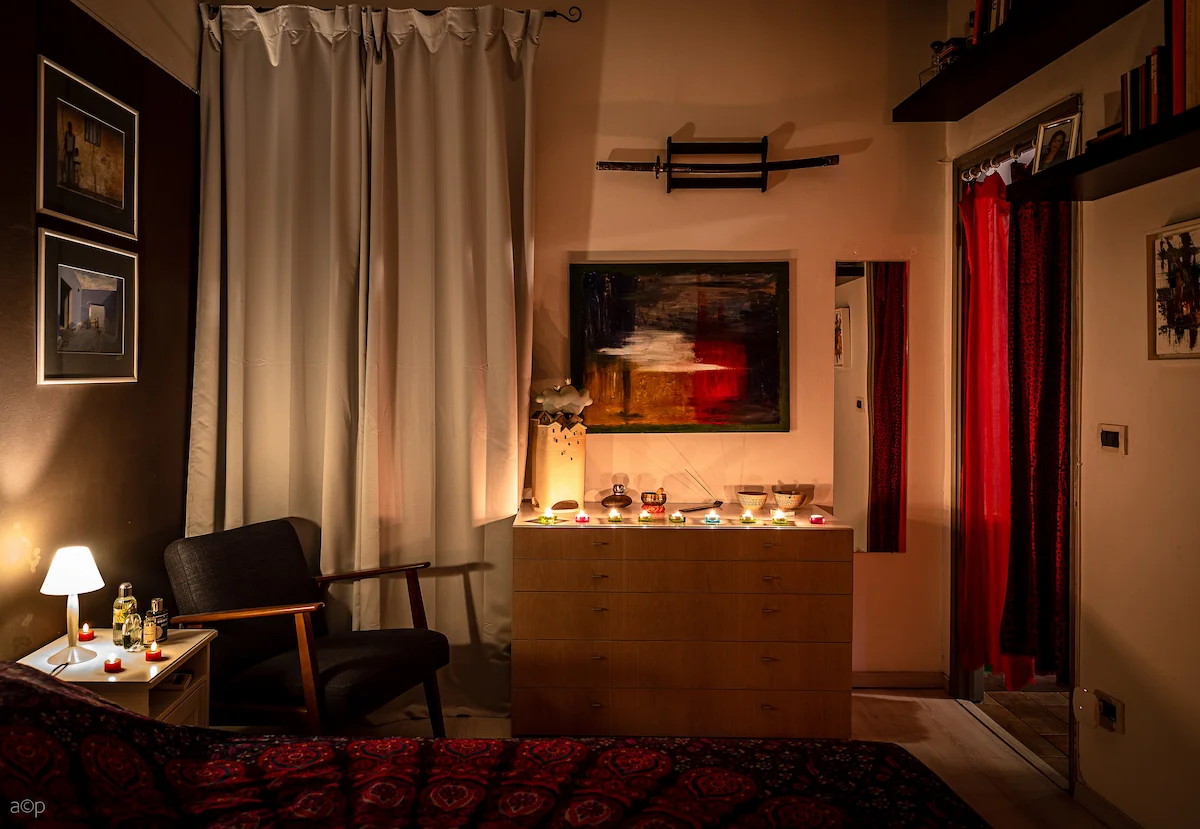 Living room with candles altar and artwork — The Wild Nest, Ferrara